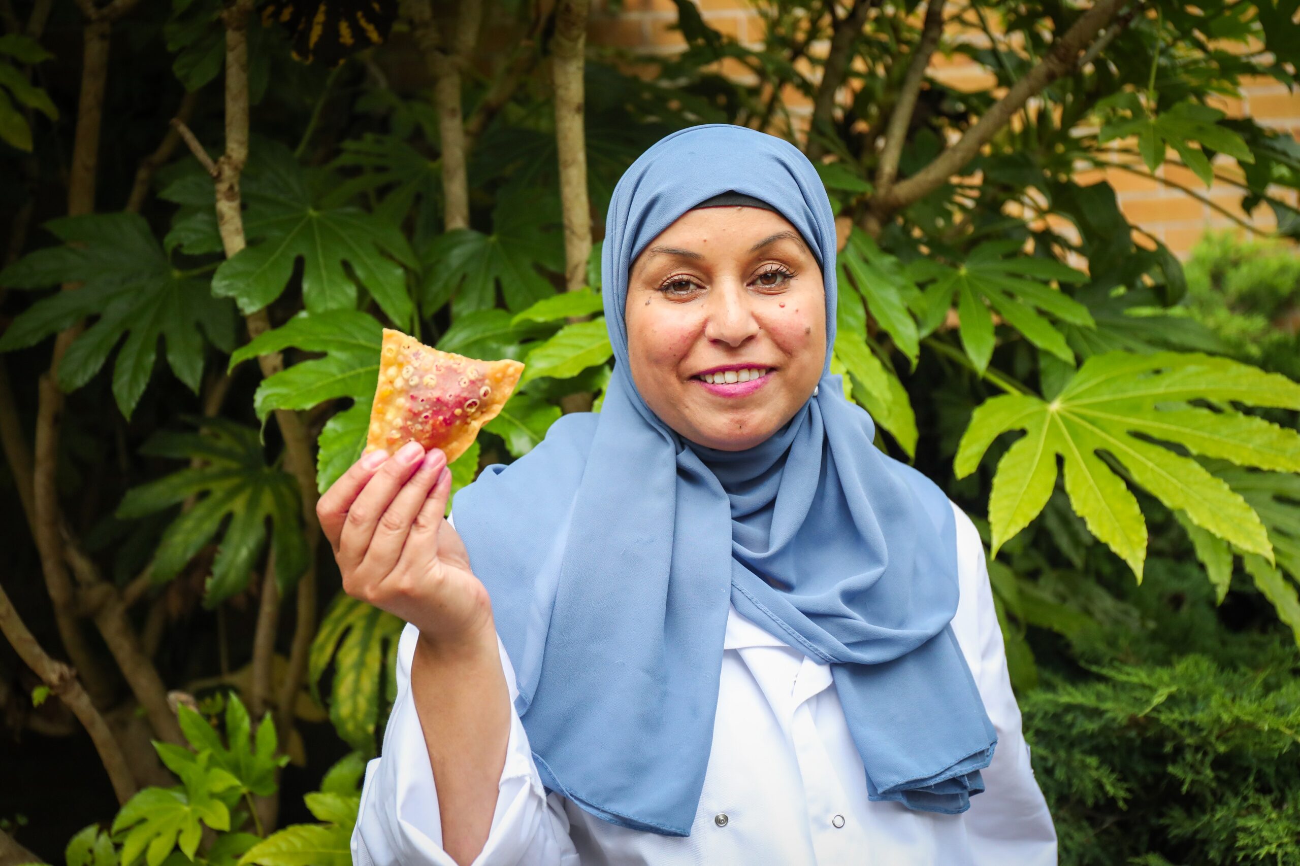 Chef holding samosa